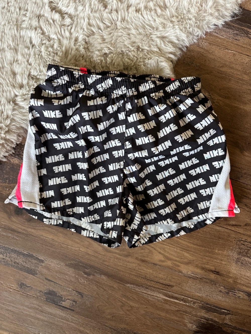 Nike Kids Black and White Logo Print Athletic Shorts with Pink Accent